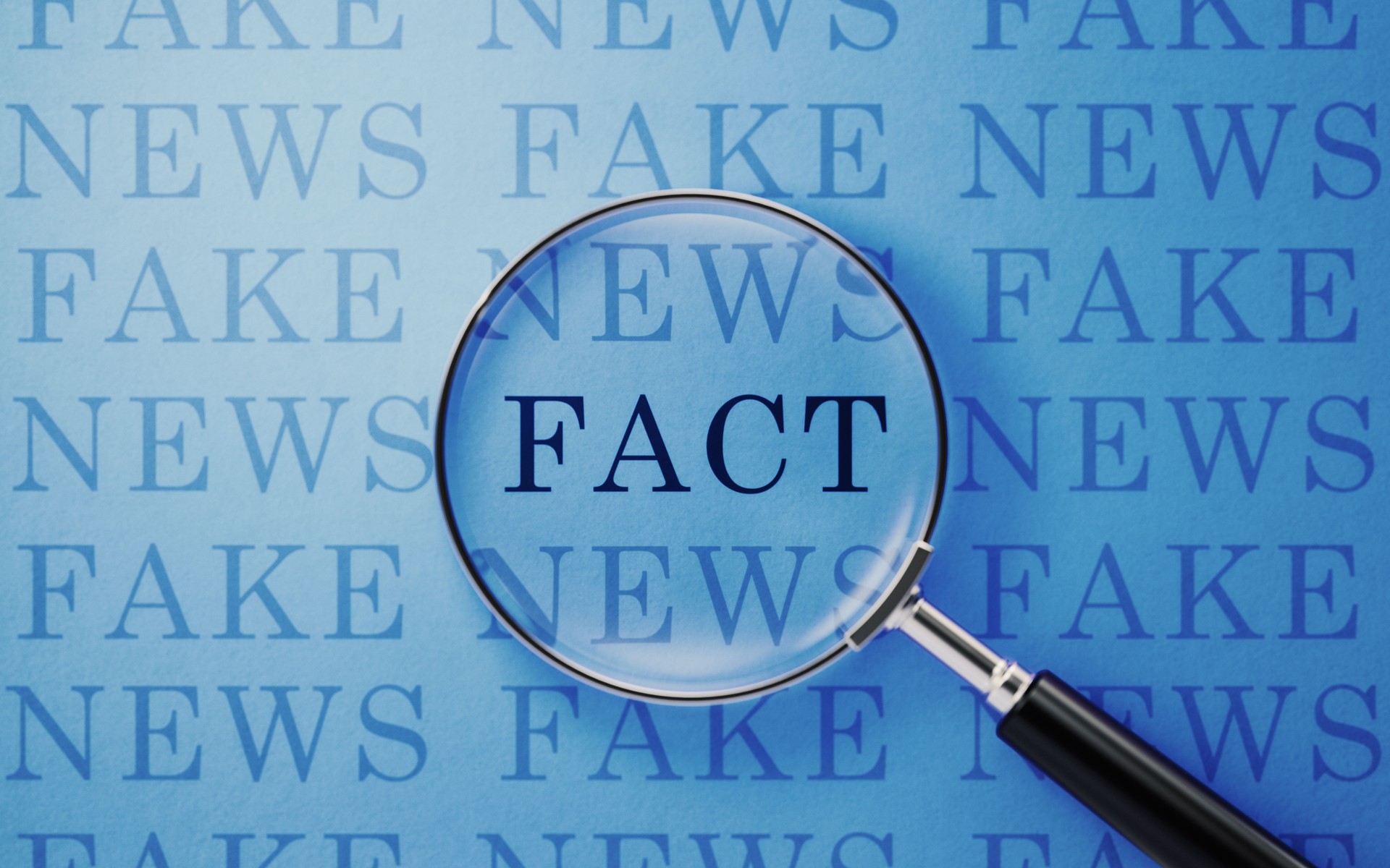 Fake News And Fact Concept - Magnifier And Fake News Text On Blue Background